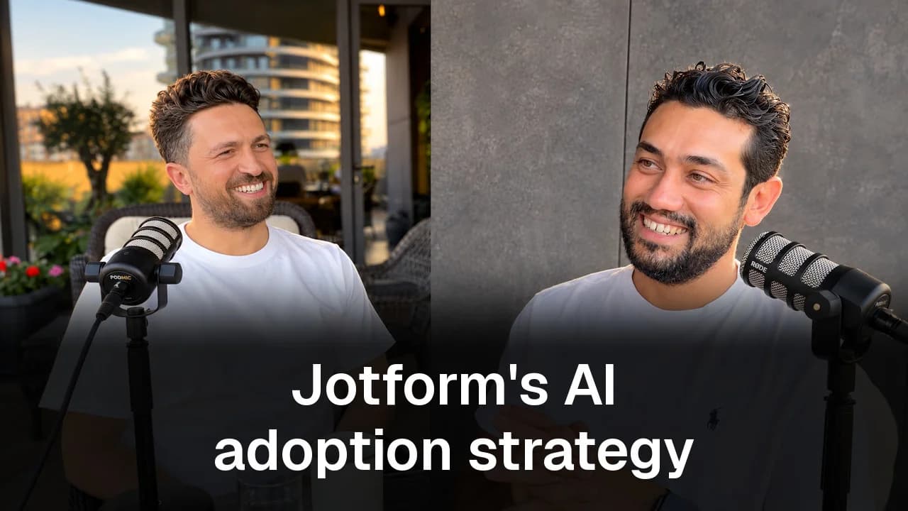 Emre Elbeyoglu and Evren Bayraktar smiling at podcast microphones above the title Jotform's AI adoption strategy